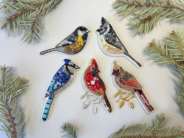 a group of birds sitting on top of a tree