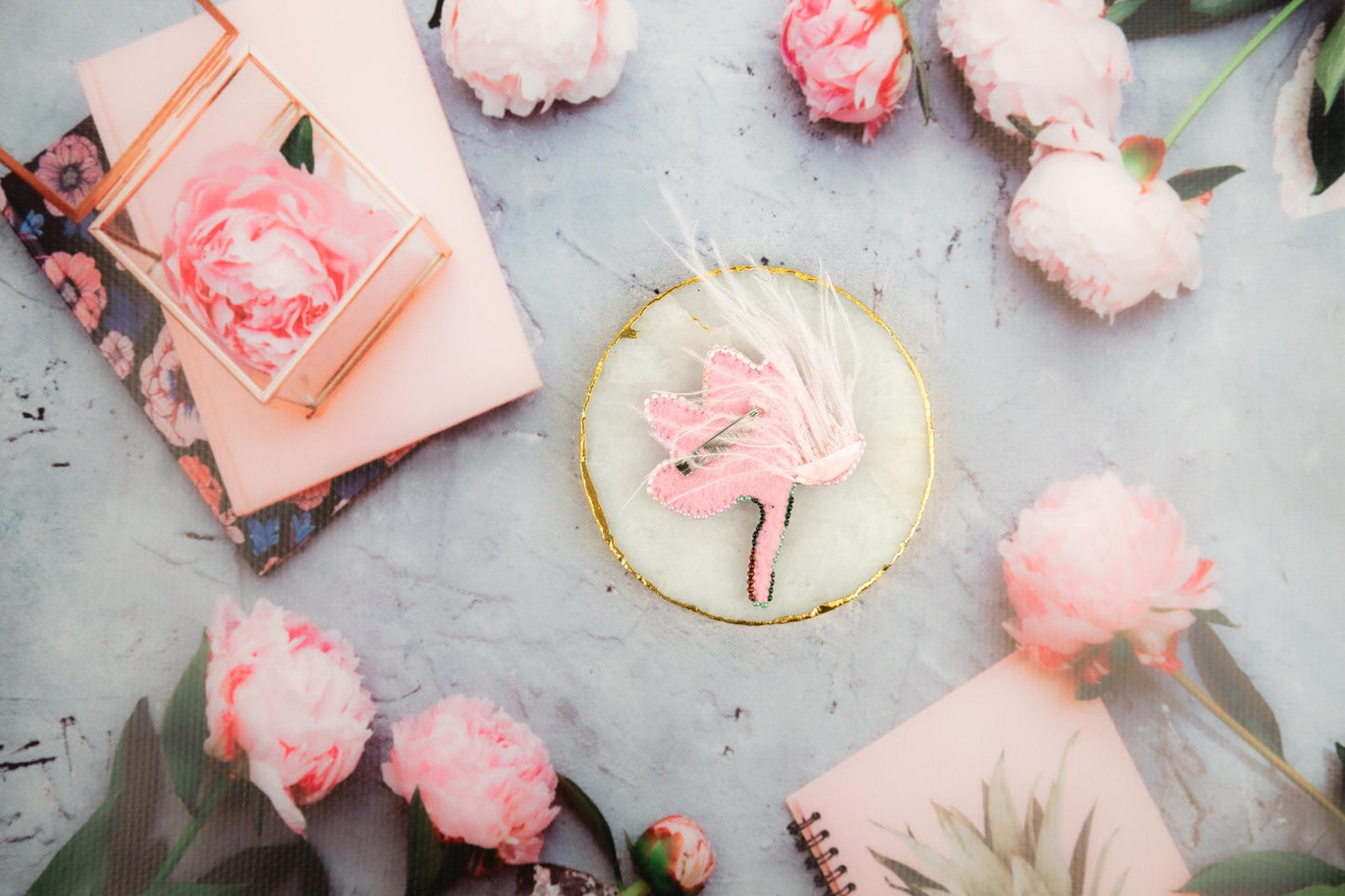 a table topped with pink and white flowers