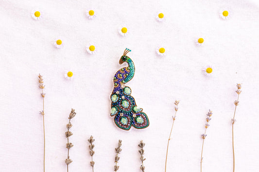 a picture of a brooch sitting on top of a table