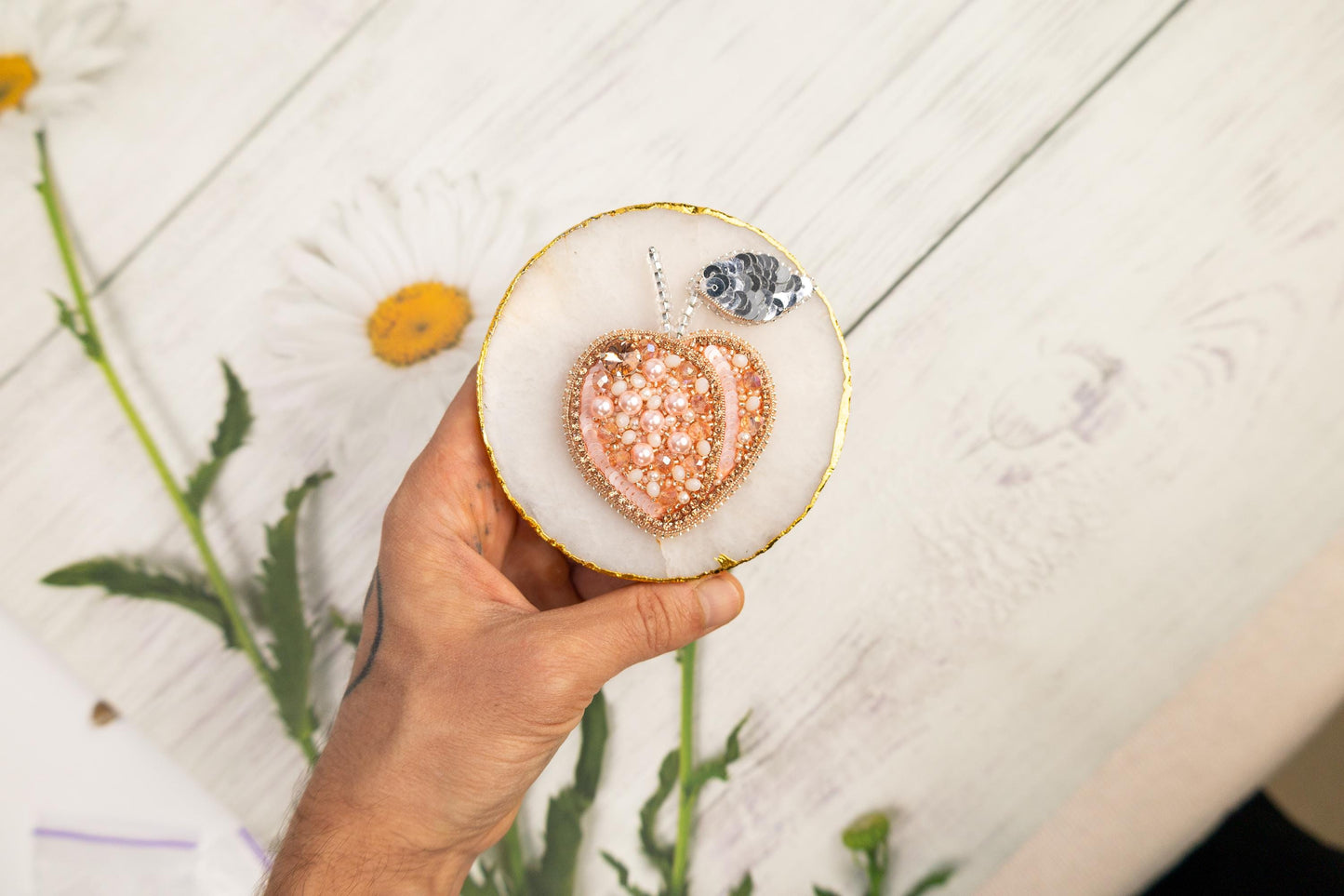 a person holding a heart shaped object in their hand