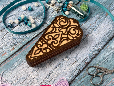 a piece of wood sitting on top of a table next to a pair of scissors