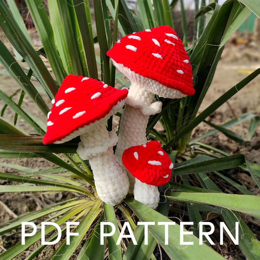 two red and white crocheted hearts on a palm tree