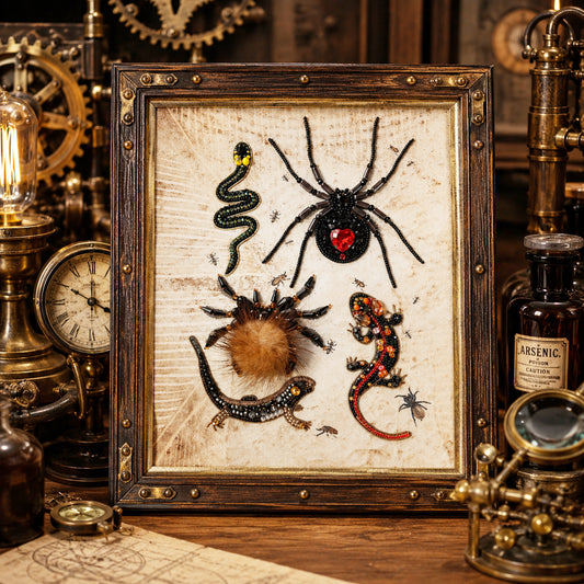 a framed collage of various insects, including a spider, a lizard, and a snake, displayed on a wooden surface.