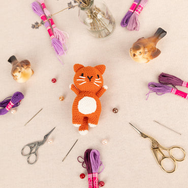 a table topped with lots of craft supplies