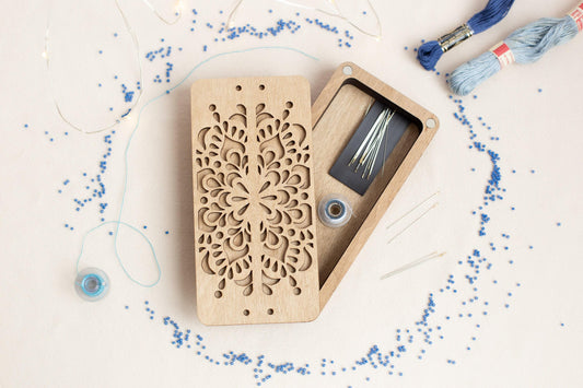 a wooden box with a piece of wood cut out of it