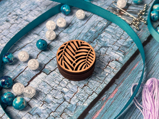 a necklace with a wooden box on it