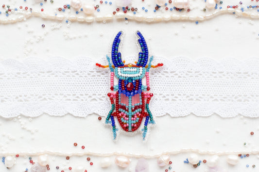 a beaded deer head on a white background
