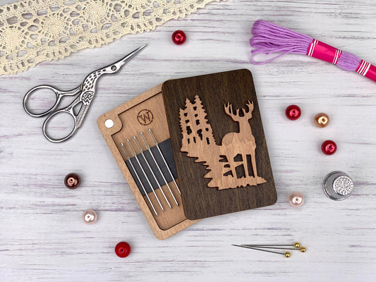 a wooden cutting board with a deer and trees cut out of it