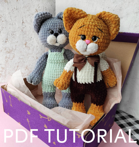 a crocheted teddy bear and a teddy bear in a box
