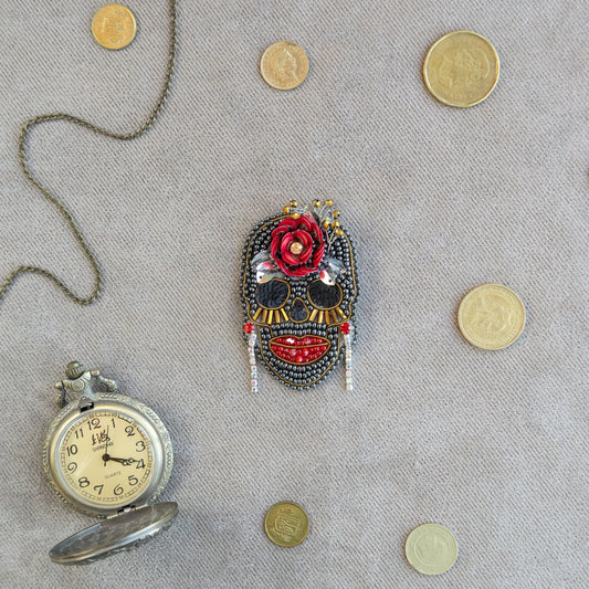 a clock and a mask on a table