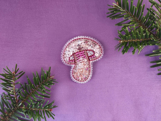 a pair of pink slippers sitting on top of a purple surface