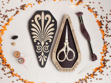 a pair of scissors sitting on top of a table