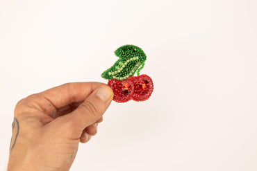 a person is holding a piece of fruit