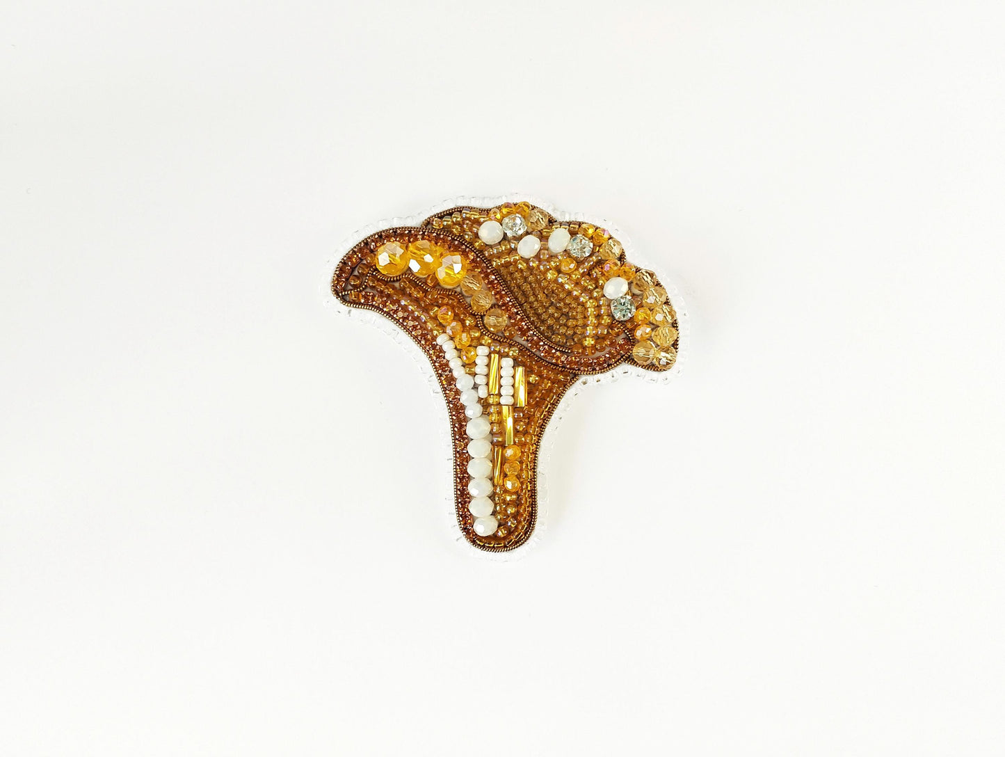 a brooch with beads and beads on it