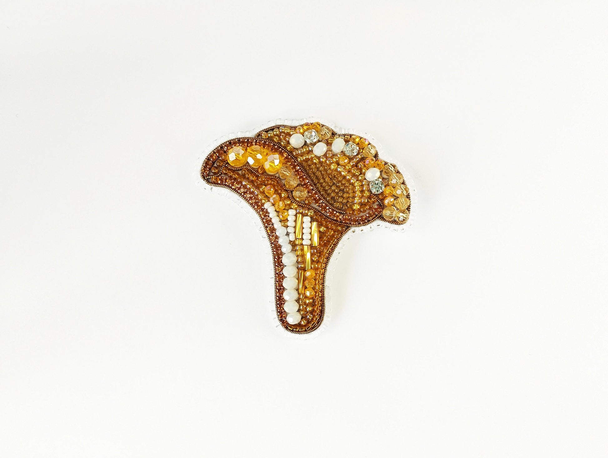a brooch with beads and beads on it