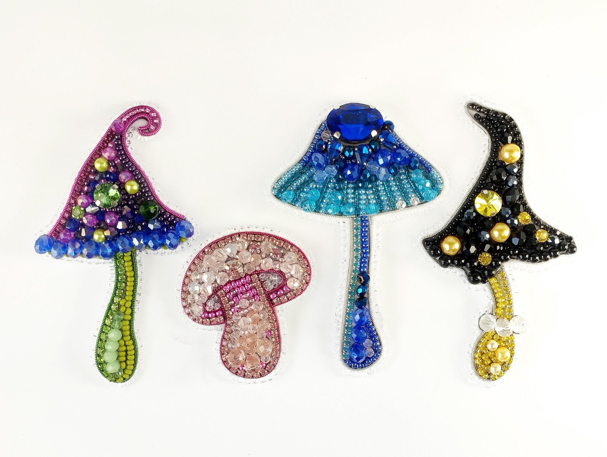 a group of three beaded mushrooms sitting on top of each other