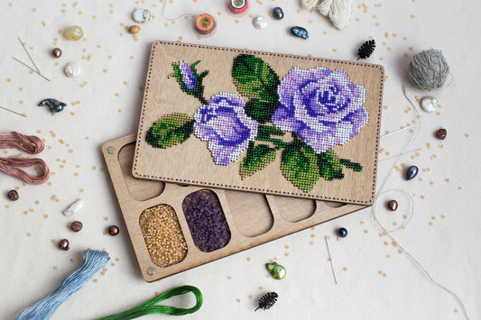 a couple of wooden trays with flowers on them