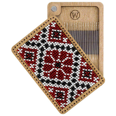 a close up of a piece of wood with a needle on it