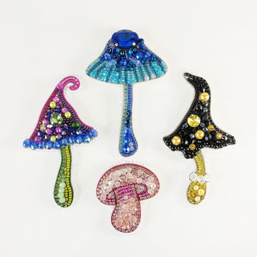 a group of three decorative items on a white surface