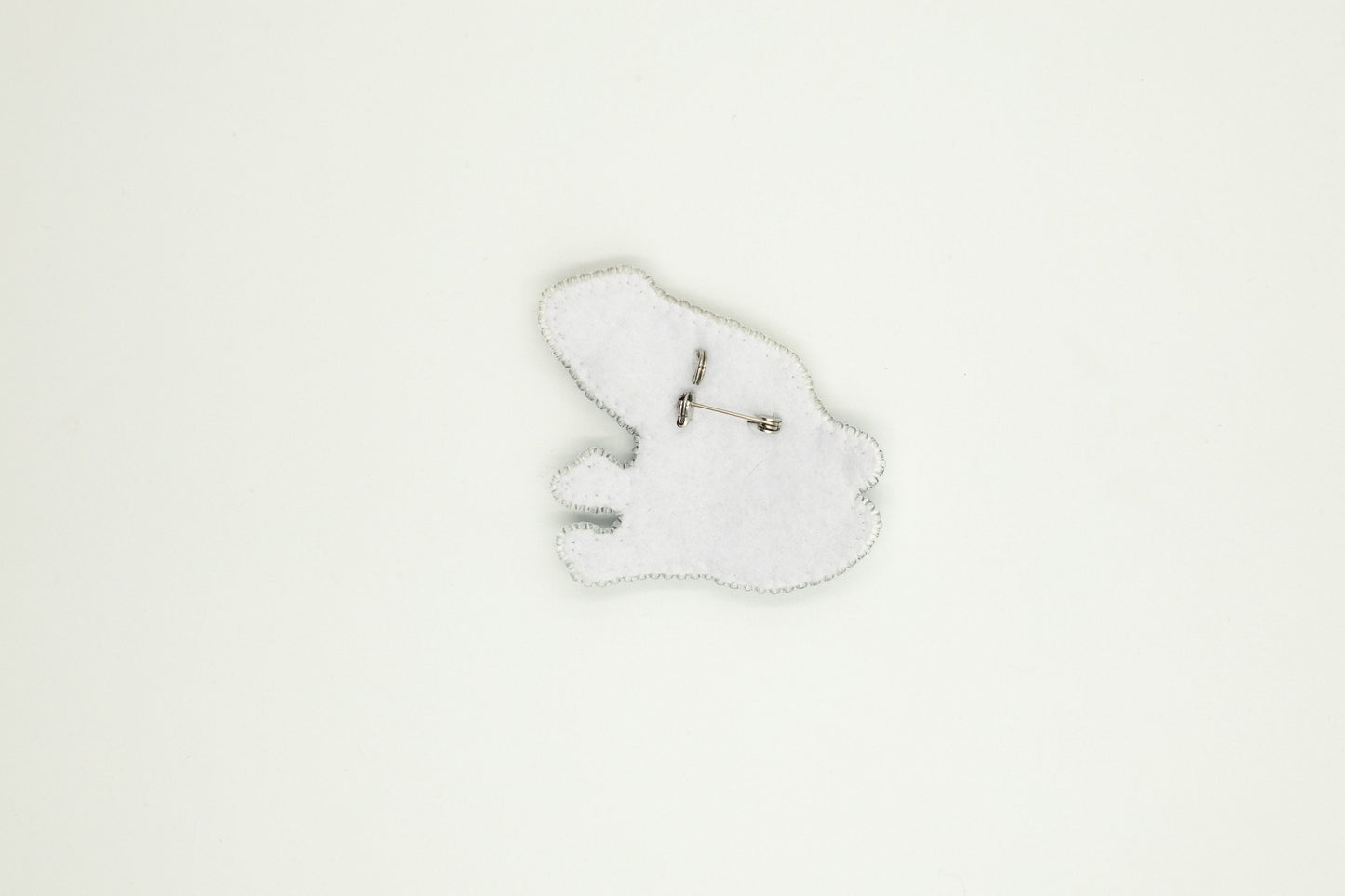 a white clock with a white background