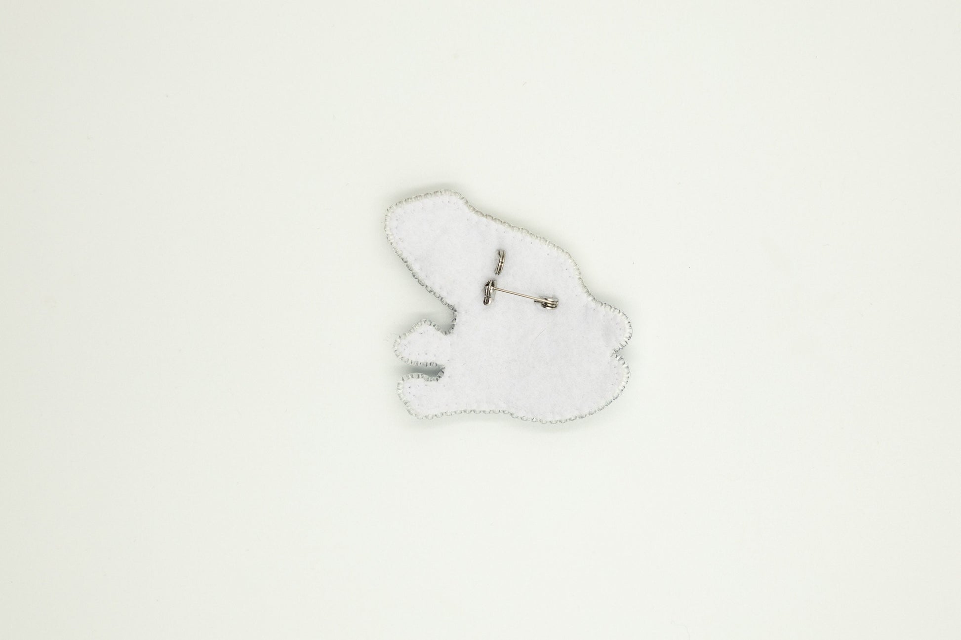 a white clock with a white background