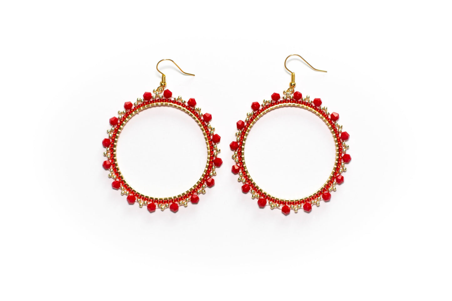 a pair of red beaded hoop earrings
