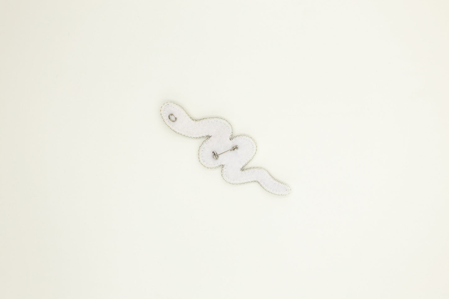 a close up of a clock on a white wall