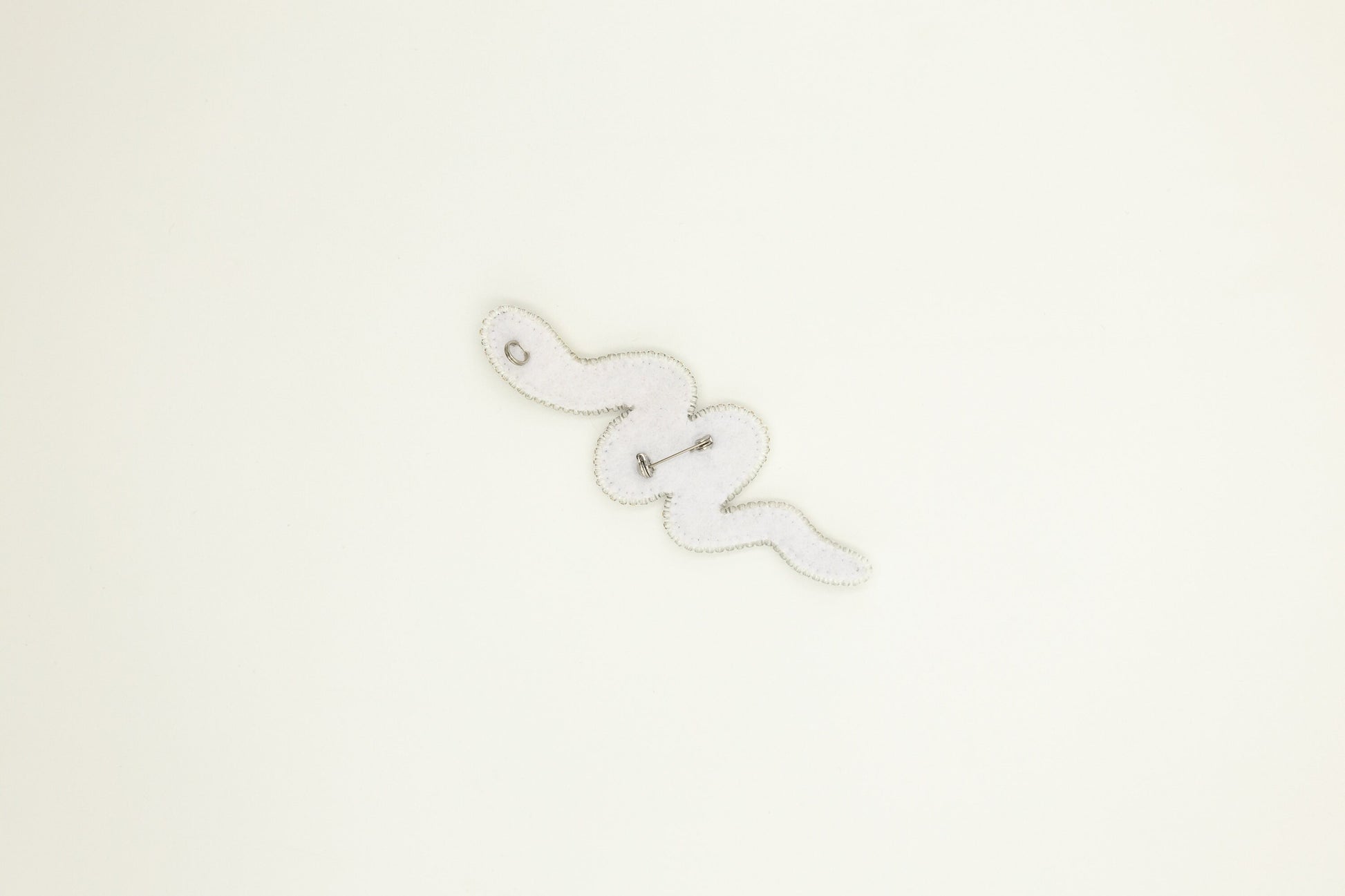 a close up of a clock on a white wall