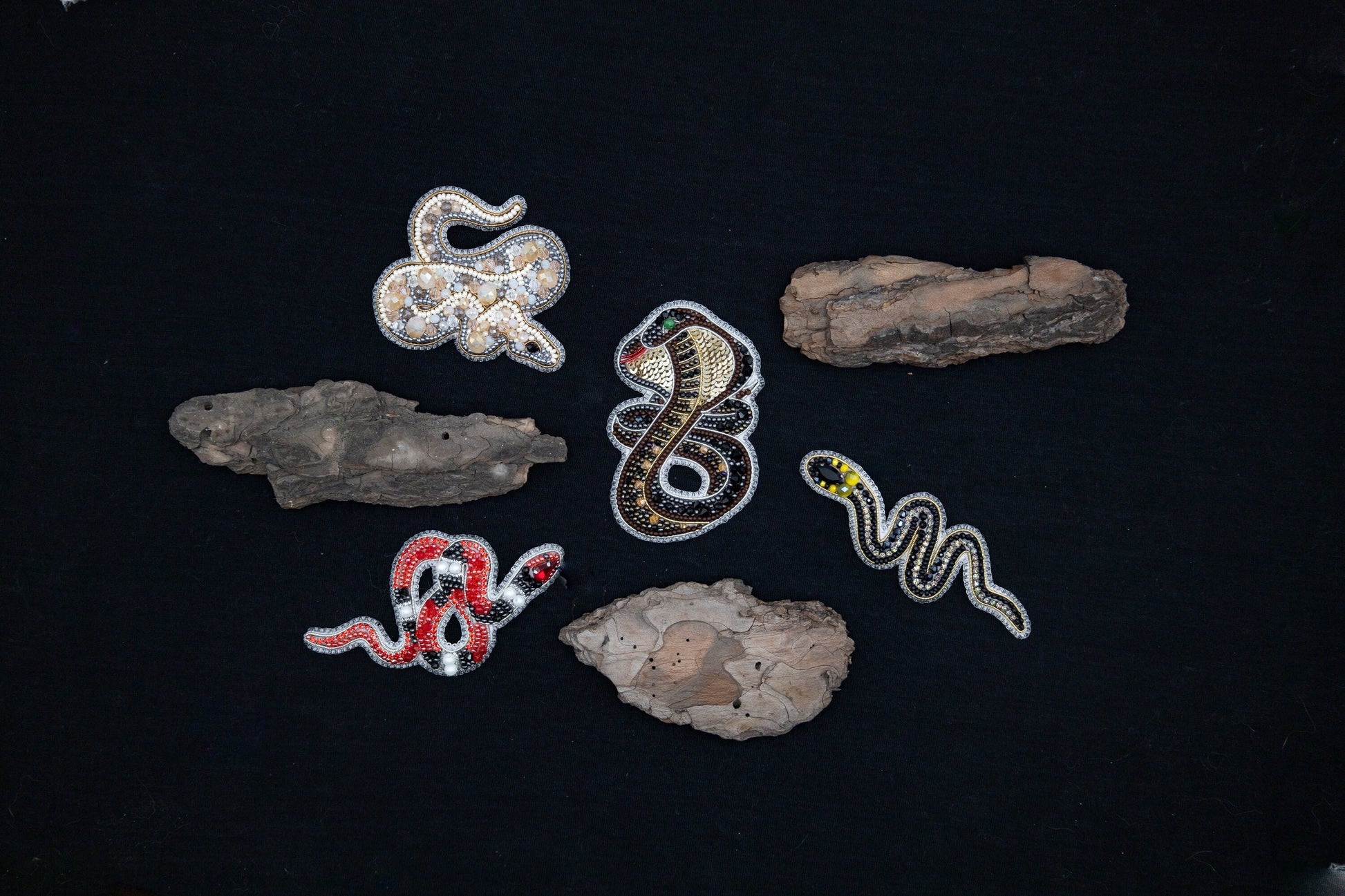 a group of different items on a black surface