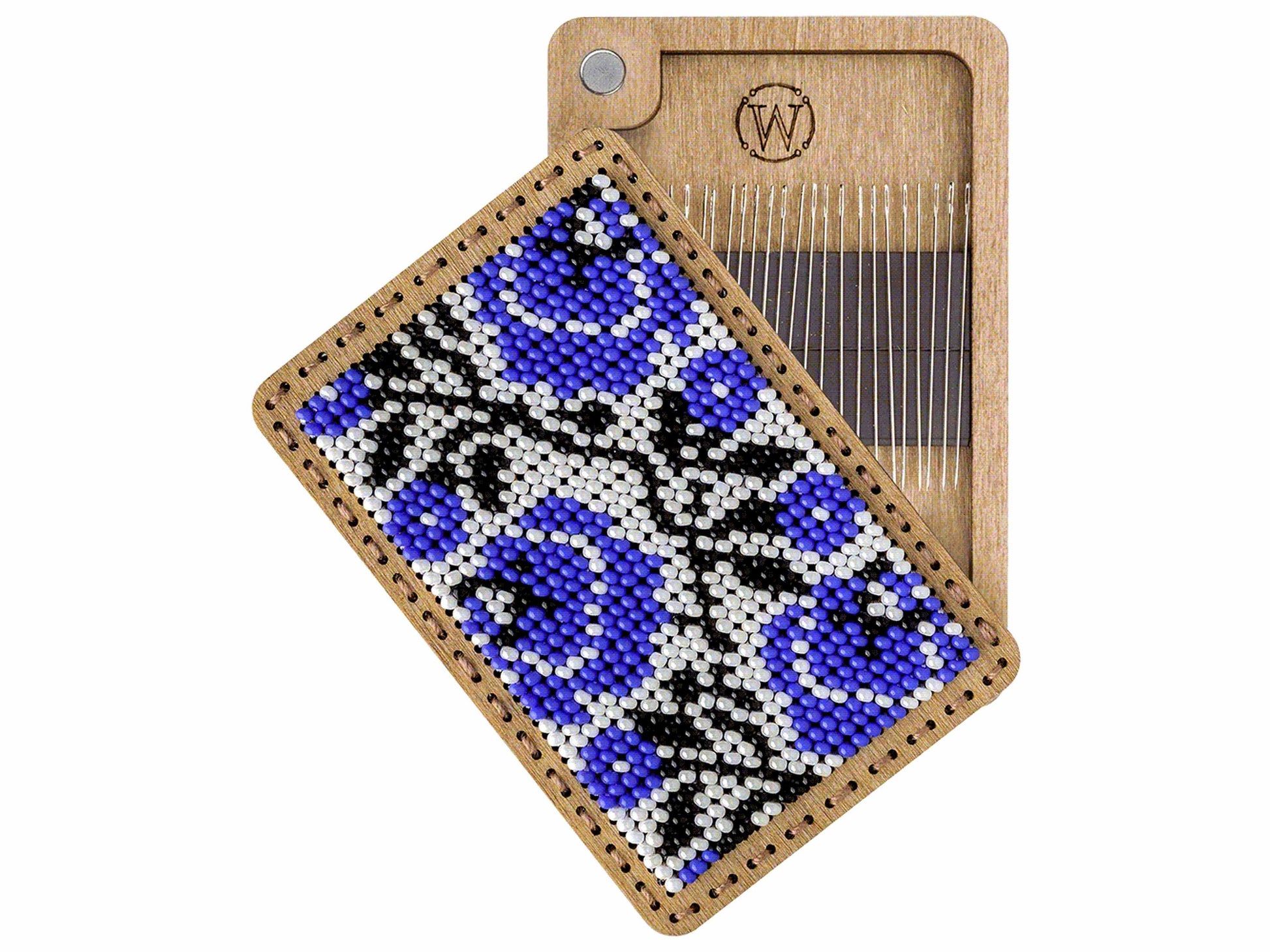 a wooden comb with a blue and black design on it