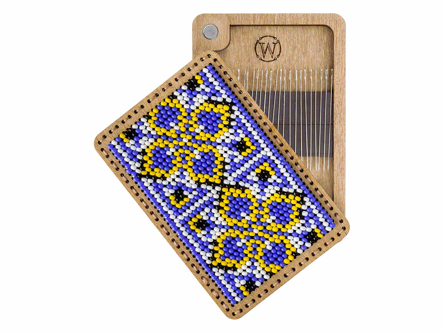 a piece of wood with a beaded design on it