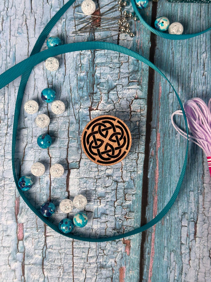 a wooden circle with a knot on it