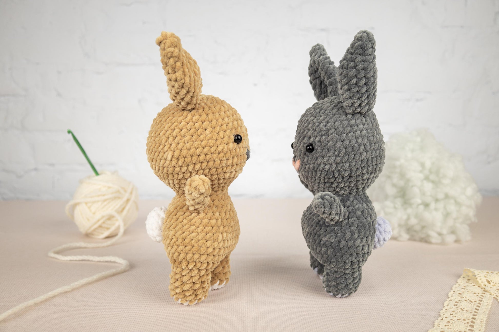 a couple of stuffed animals sitting on top of a table