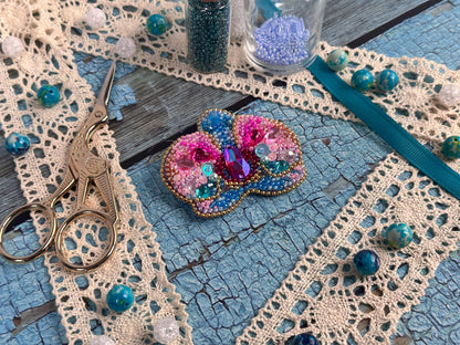 a pair of scissors sitting on top of a table