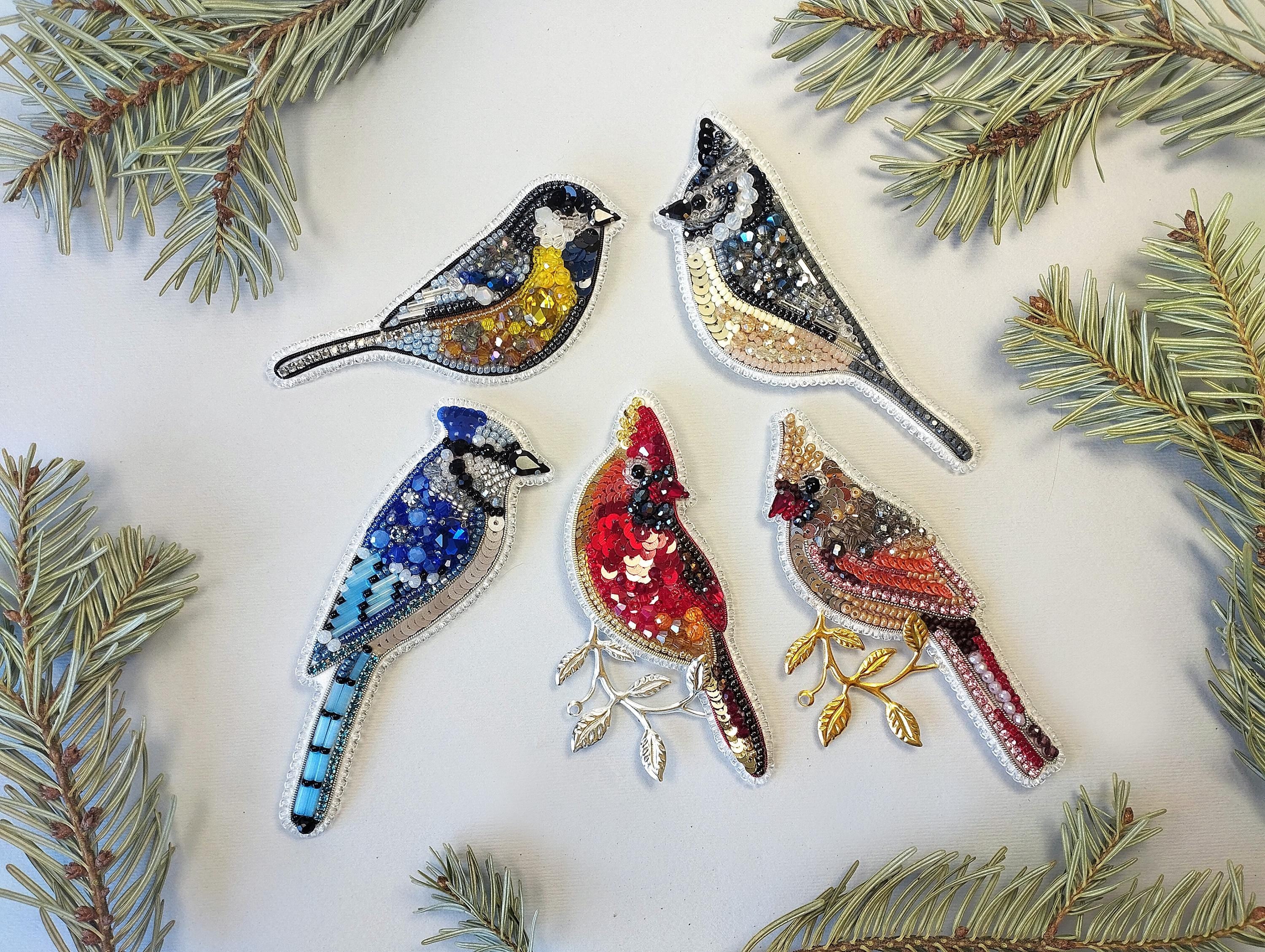 a group of birds sitting on top of a tree