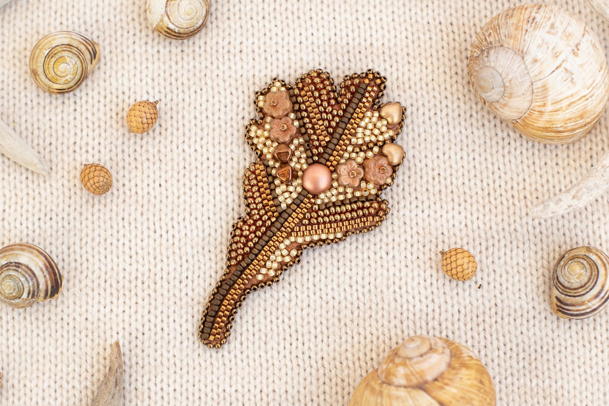 a close up of shells and beads on a cloth