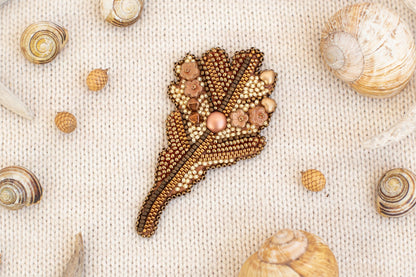 a close up of shells and beads on a cloth