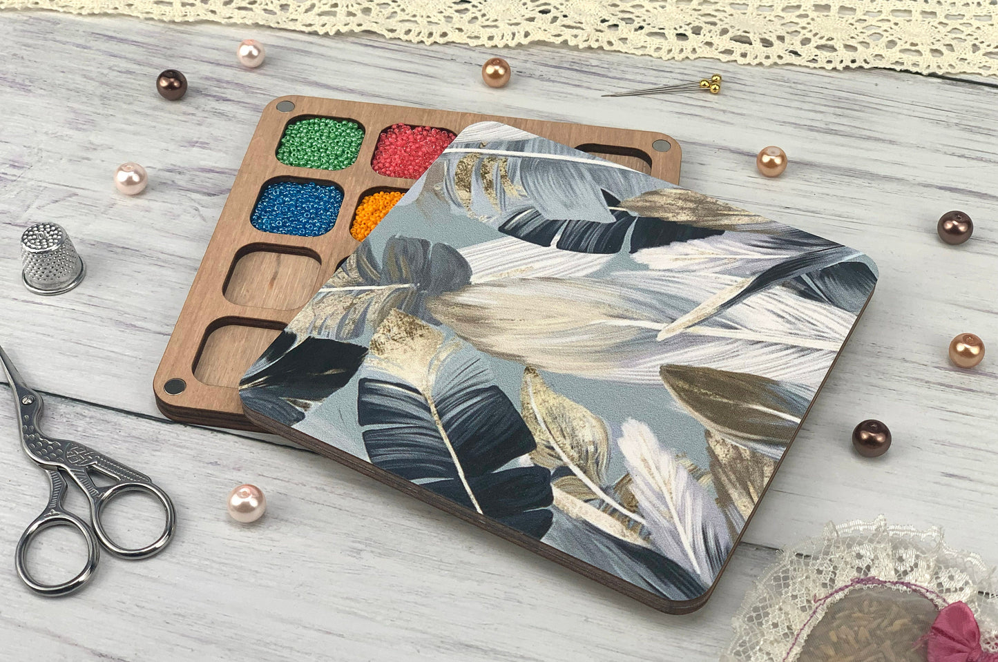 a wooden tray with paint and a pair of scissors