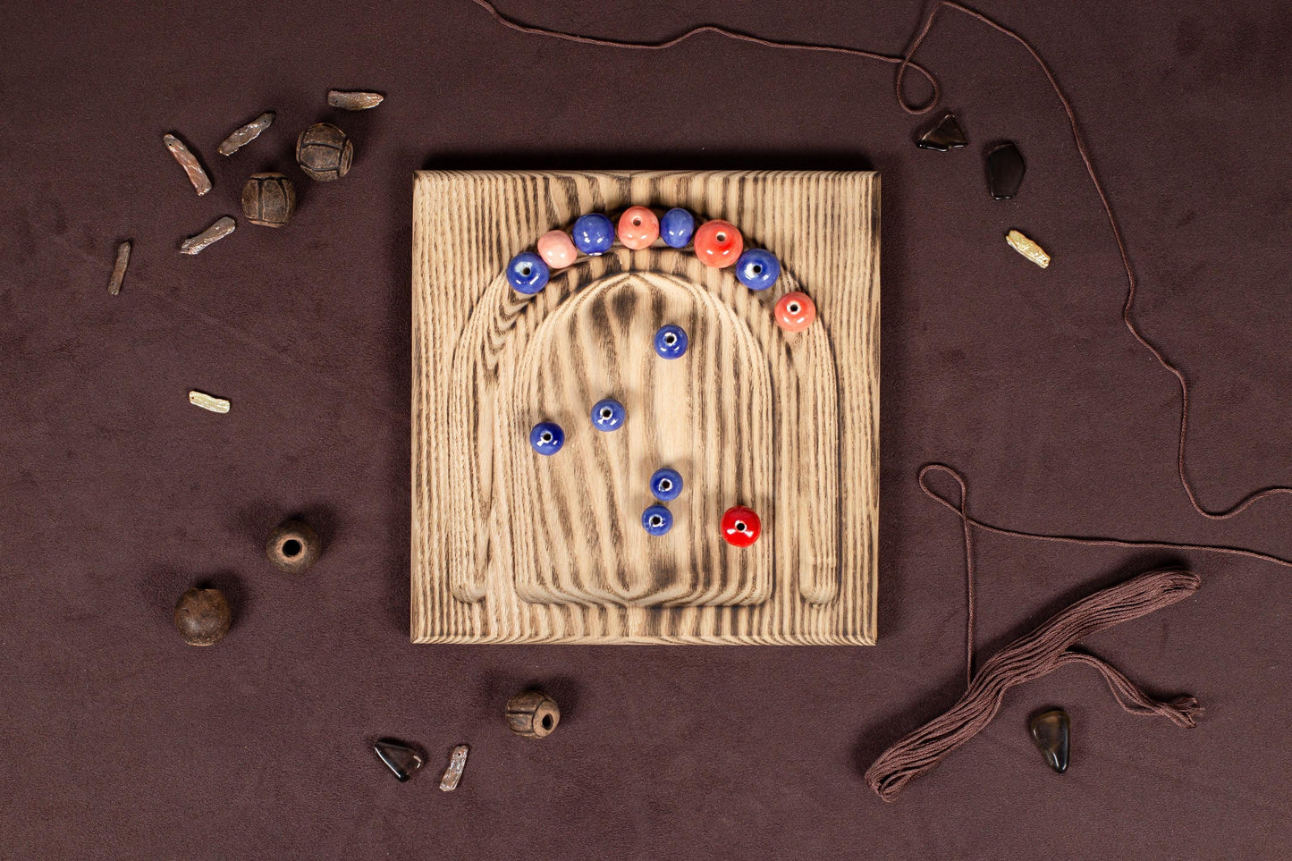 a wooden board with a bunch of buttons on it
