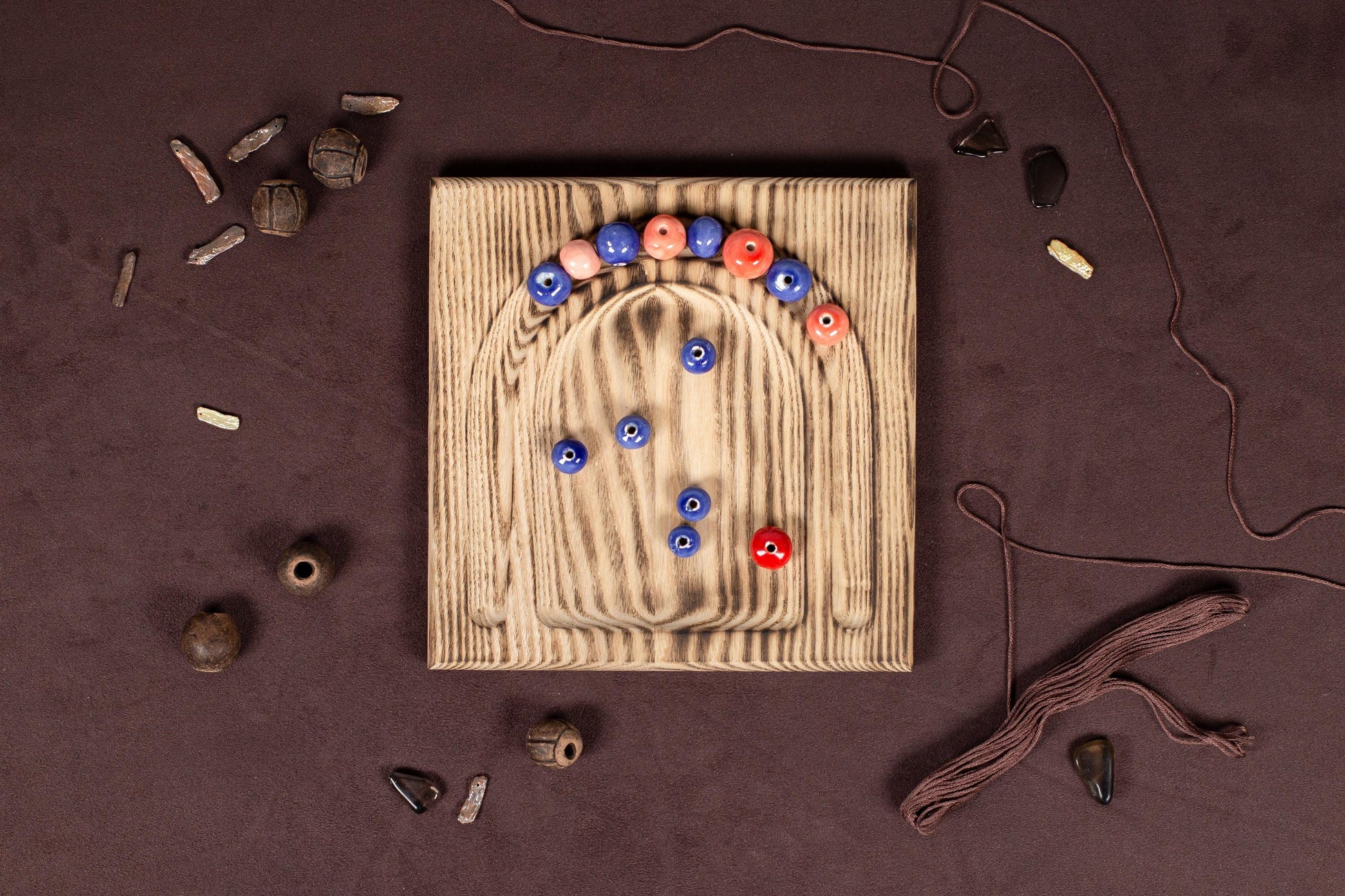 a wooden board with a bunch of buttons on it