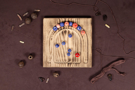 a wooden board with a bunch of buttons on it