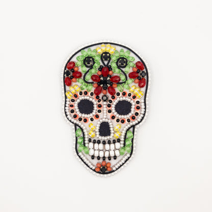 a beaded sugar skull on a white background