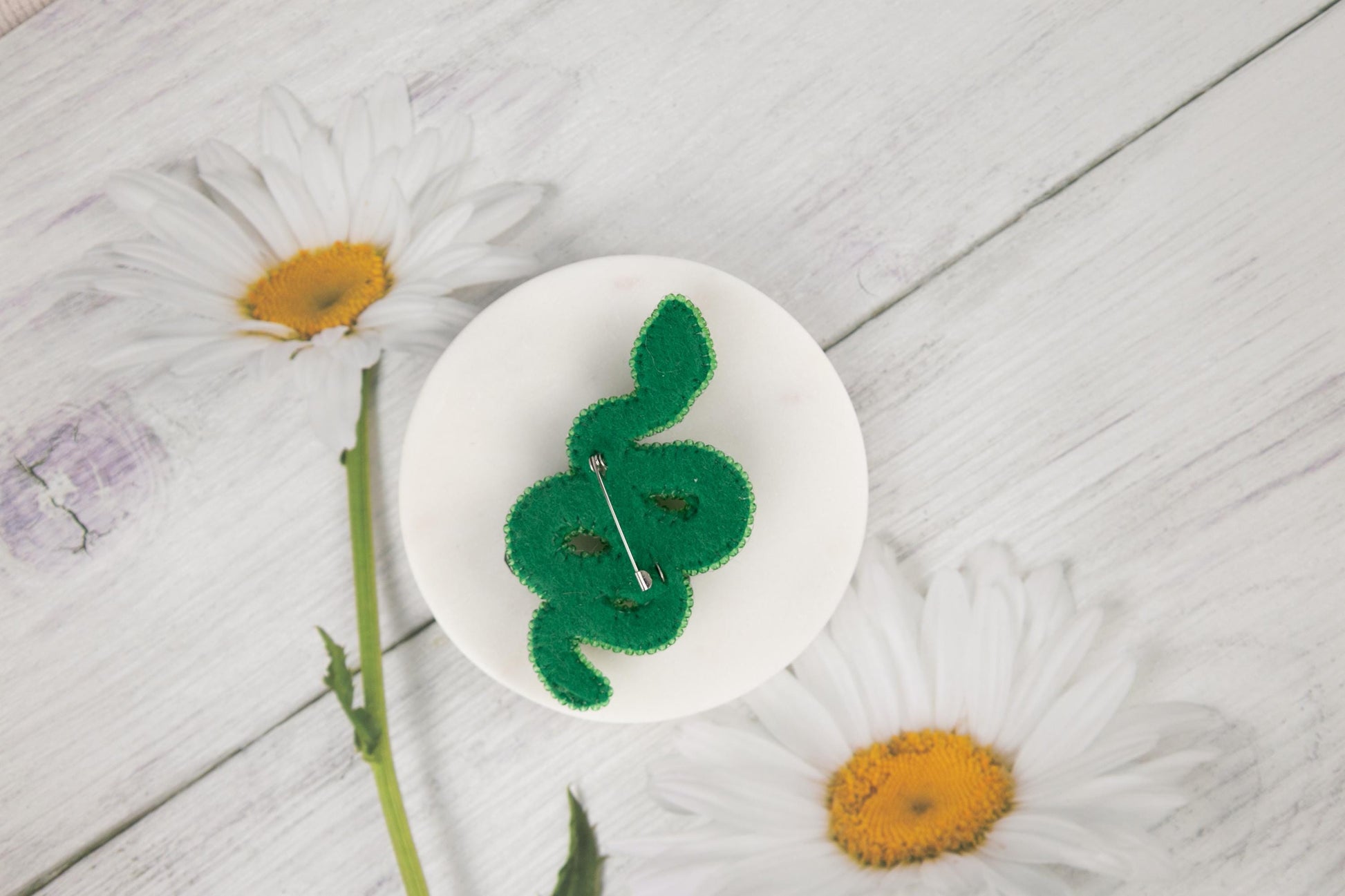 a white plate with a green bunny on it