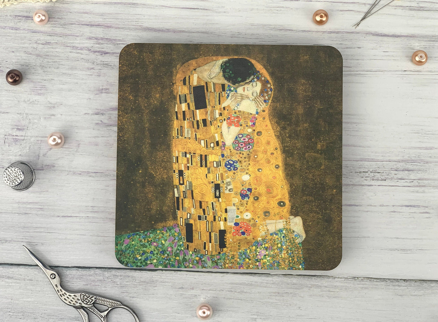 a mouse pad with a painting of a woman&#39;s face