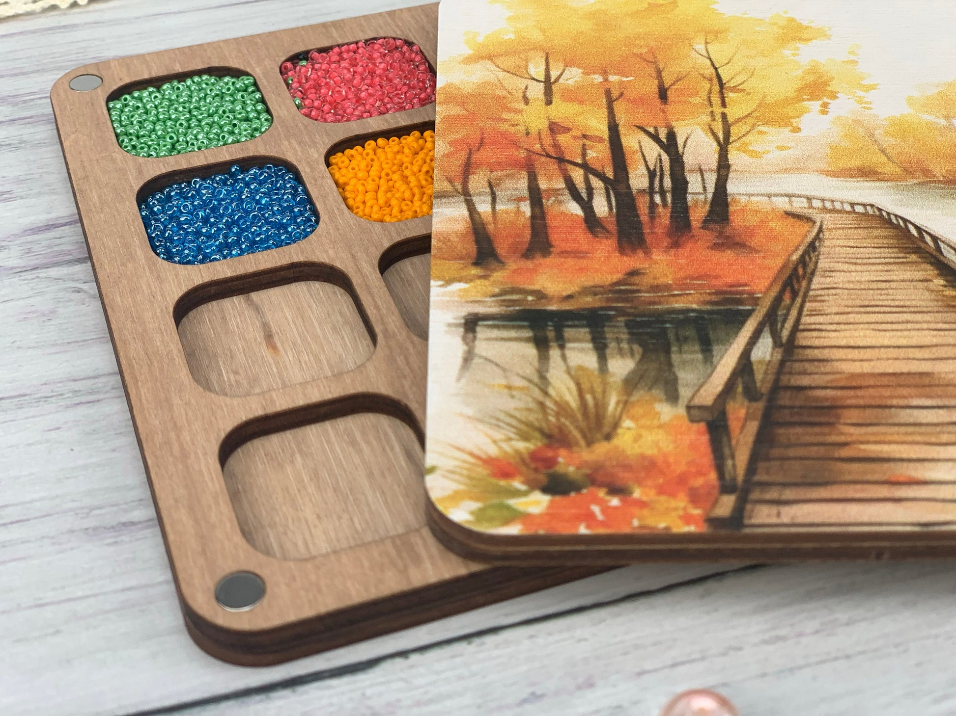 a wooden box with a watercolor painting on it