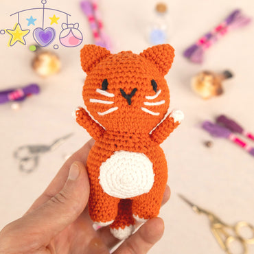 a table topped with lots of craft supplies