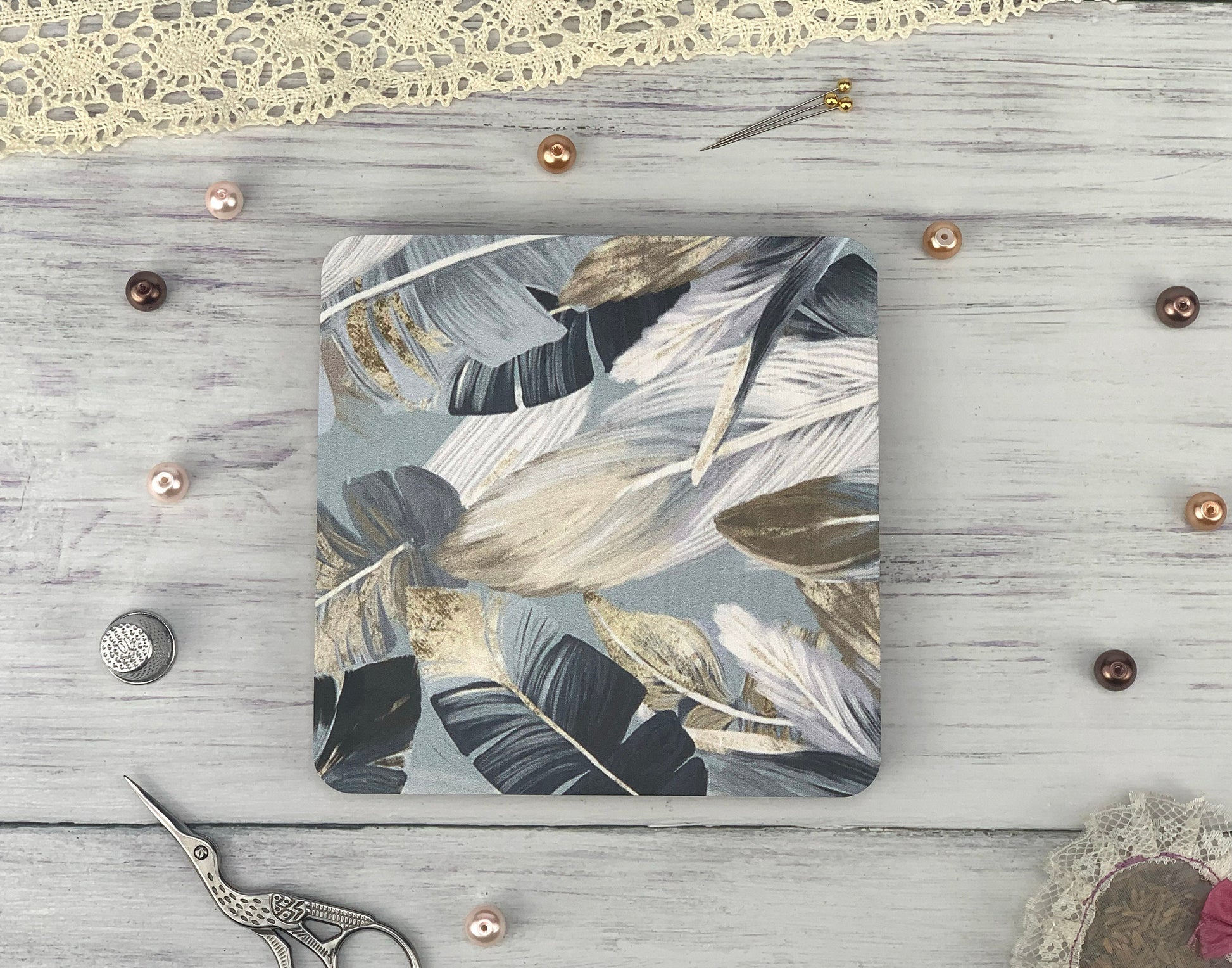 a wooden table topped with a cutting board and a pair of scissors