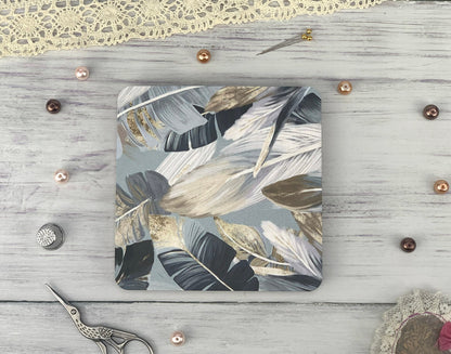 a wooden table topped with a cutting board and a pair of scissors