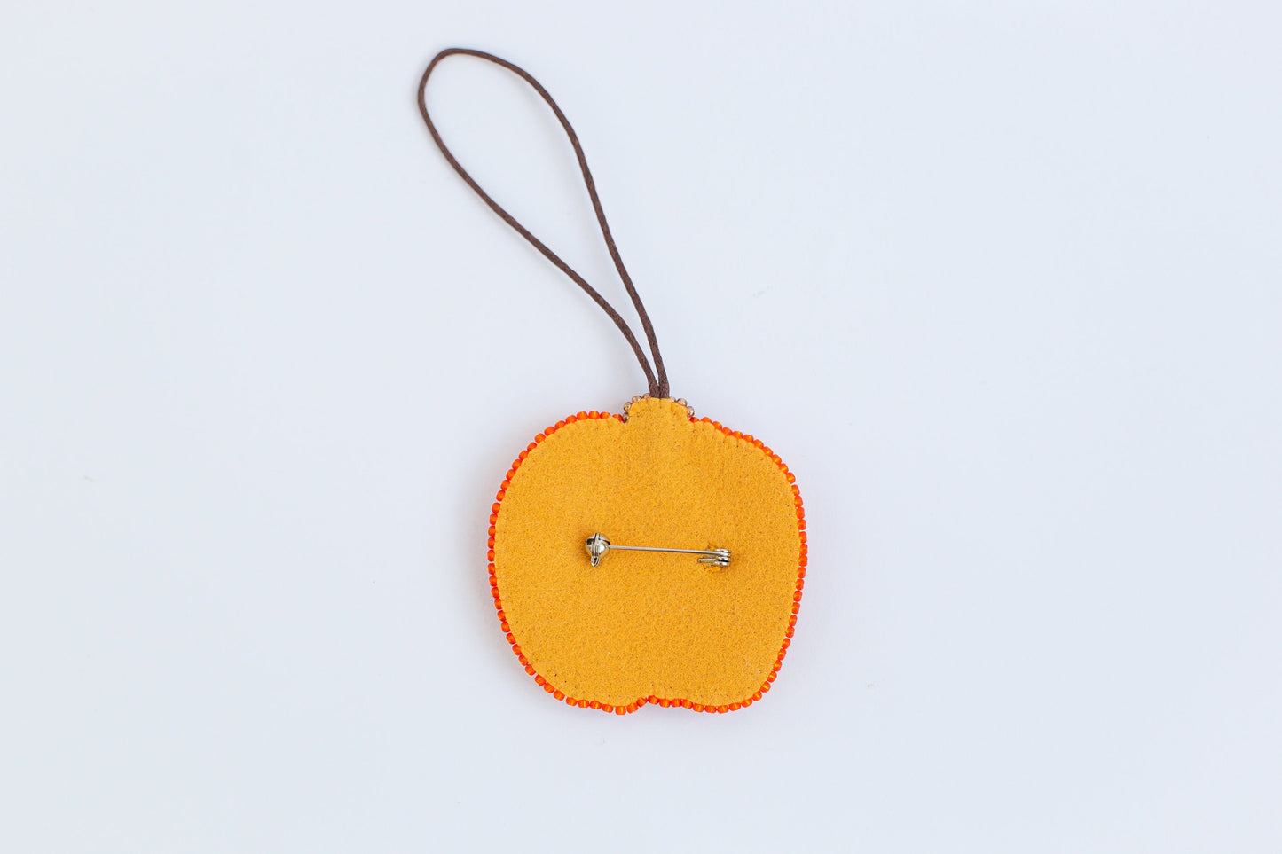 an orange piece of fabric with a metal hook