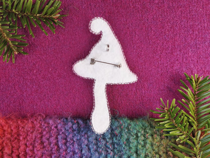 a knitted piece of fabric with a mushroom on it